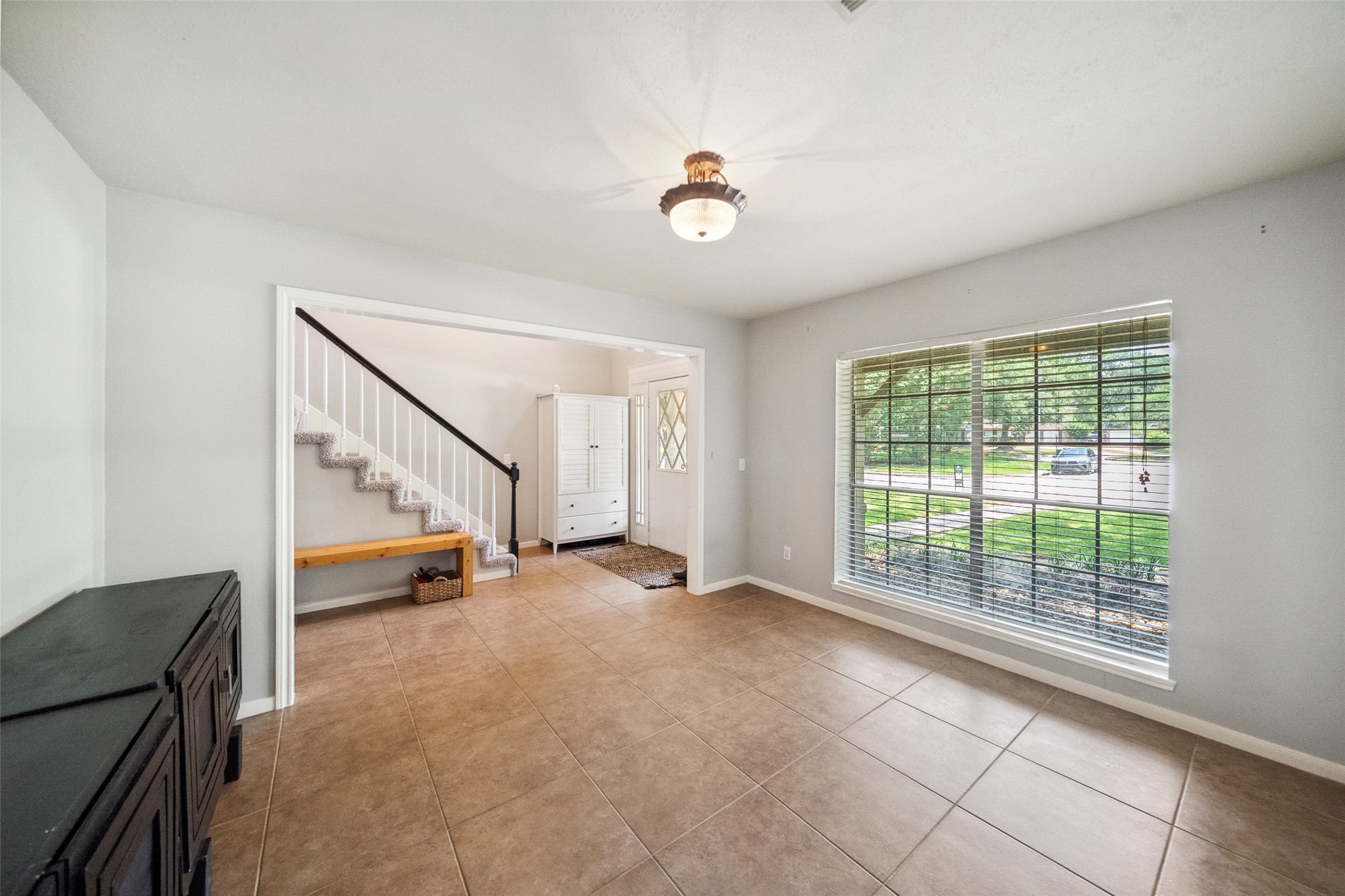 20407 Weald Way Street Spring, TX 77388 - Photo 5 of 31 a view of an empty room with a window