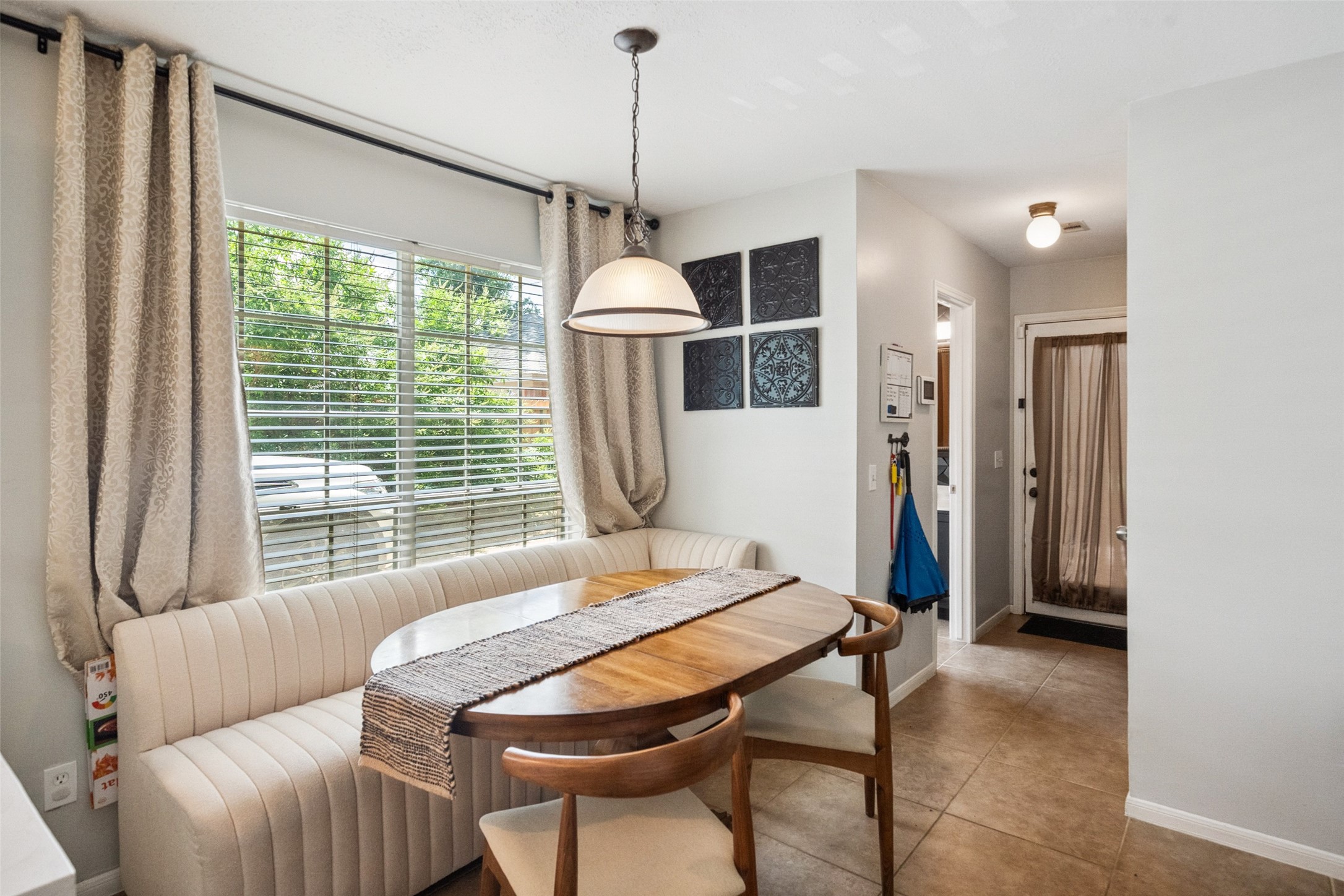 20407 Weald Way Street Spring, TX 77388 - Photo 10 of 31 a living room with furniture a window and a chandelier