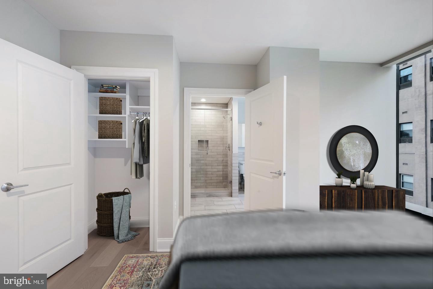 60 North 23rd Street, Unit 2013 Philadelphia, PA 19103 - Photo 10 of 46 a bedroom with a bed and a chandelier