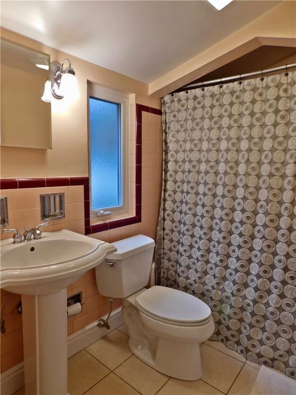 604 Cascade Road Forest Hills, PA 15221 - Photo 17 of 25 Great period tile has been updated with fixtures, flooring and the perfect paint color!