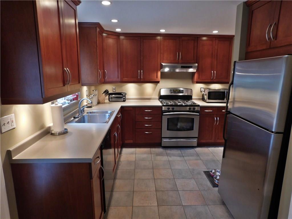 604 Cascade Road Forest Hills, PA 15221 - Photo 3 of 25 This kitchen is really well done, with many bells and whistles. Quality cabinetry with dovetail joinery, under cabinet lighting and GE Profile appliances. The tile floor goes perfectly with the rest of the kitchen