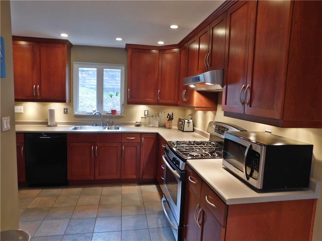 604 Cascade Road Forest Hills, PA 15221 - Photo 4 of 25 The kitchen also has a Bosch dishwasher and the microwave oven is included. It is so well designed and executed, lots of space in the tall cabinets. The window and back door lead to a patio that is almost as wide as the house.