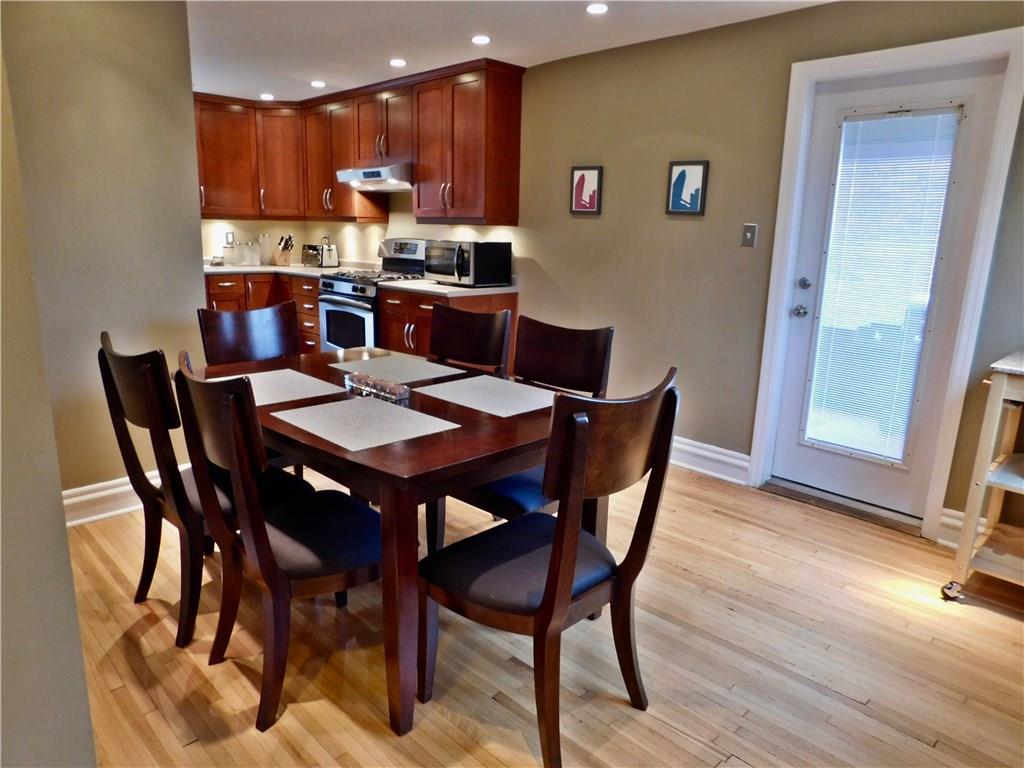 604 Cascade Road Forest Hills, PA 15221 - Photo 10 of 25 There is still lots of space, even with a dining room table for 6 people! The glass door leads to the side porch and has blinds sealed between the panes of glass.