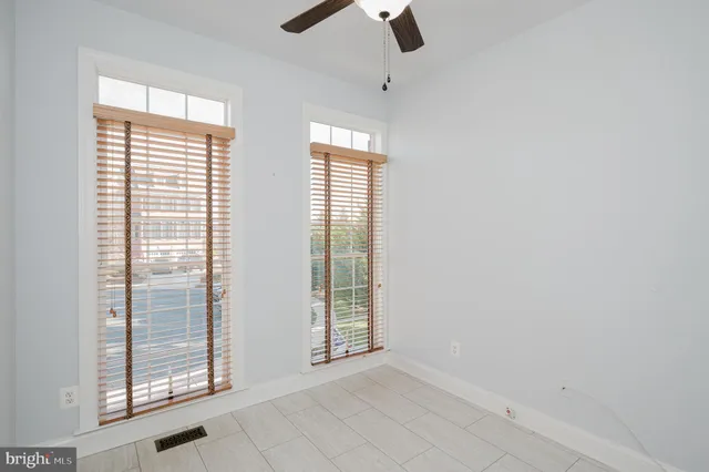 a kitchen with stainless steel appliances granite countertop a refrigerator a stove and a sink