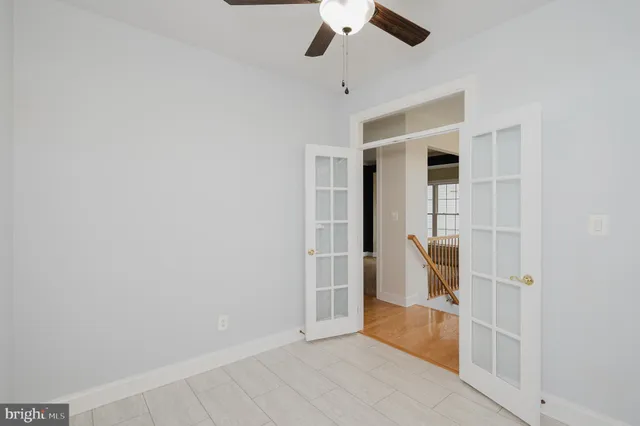 a kitchen with granite countertop a refrigerator and a sink