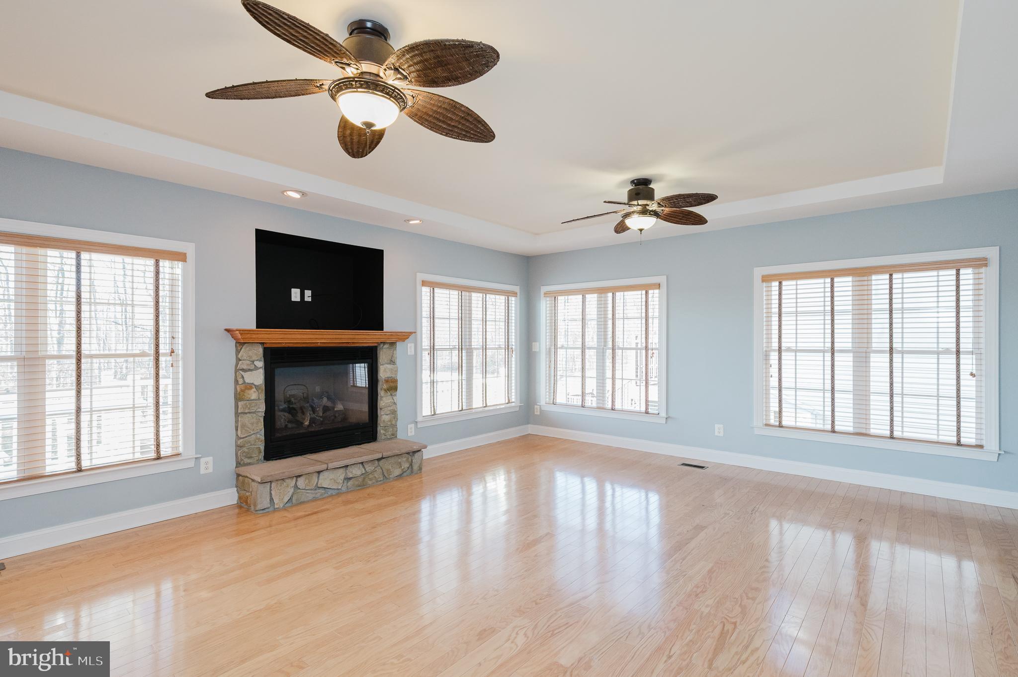 130 Fallston Meadow Court Fallston, MD 21047 - Photo 31 of 80 a view of an empty room with a fireplace and a window