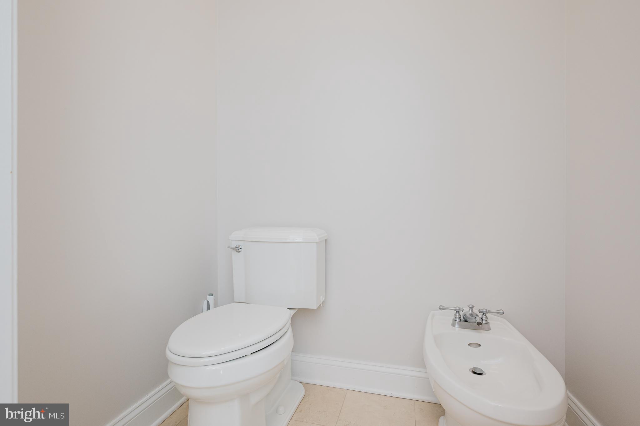 130 Fallston Meadow Court Fallston, MD 21047 - Photo 39 of 80 a white toilet sitting next to a white sink