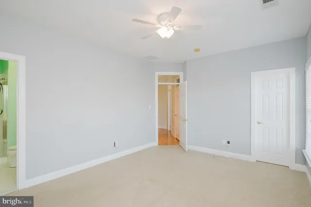 a view of a backyard with swimming pool