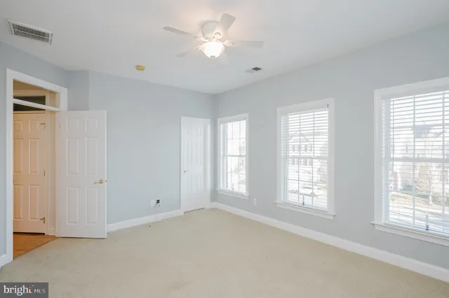 a view of a porch with a table and chairs