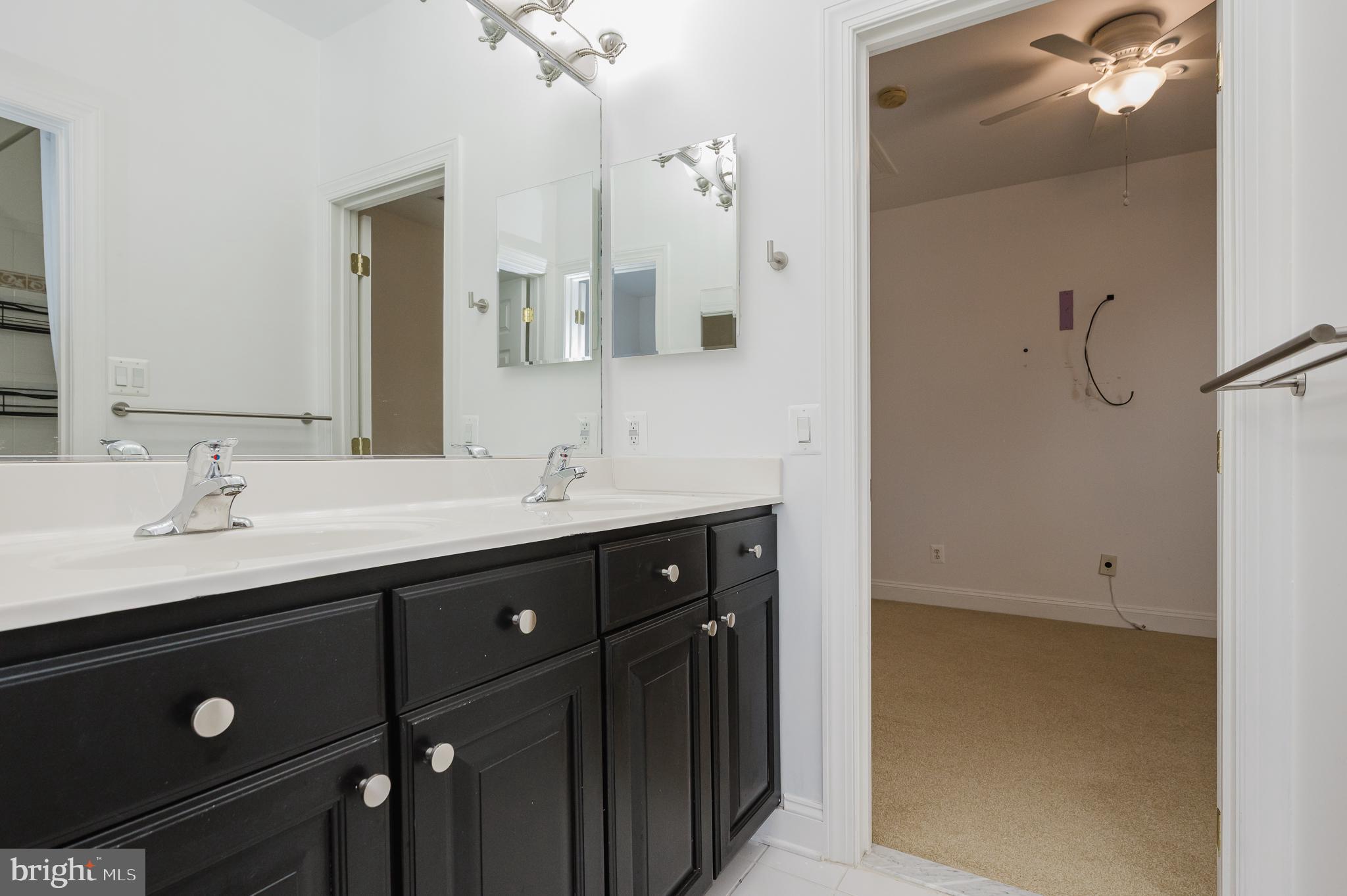 130 Fallston Meadow Court Fallston, MD 21047 - Photo 52 of 80 a bathroom with a double vanity sink and mirror