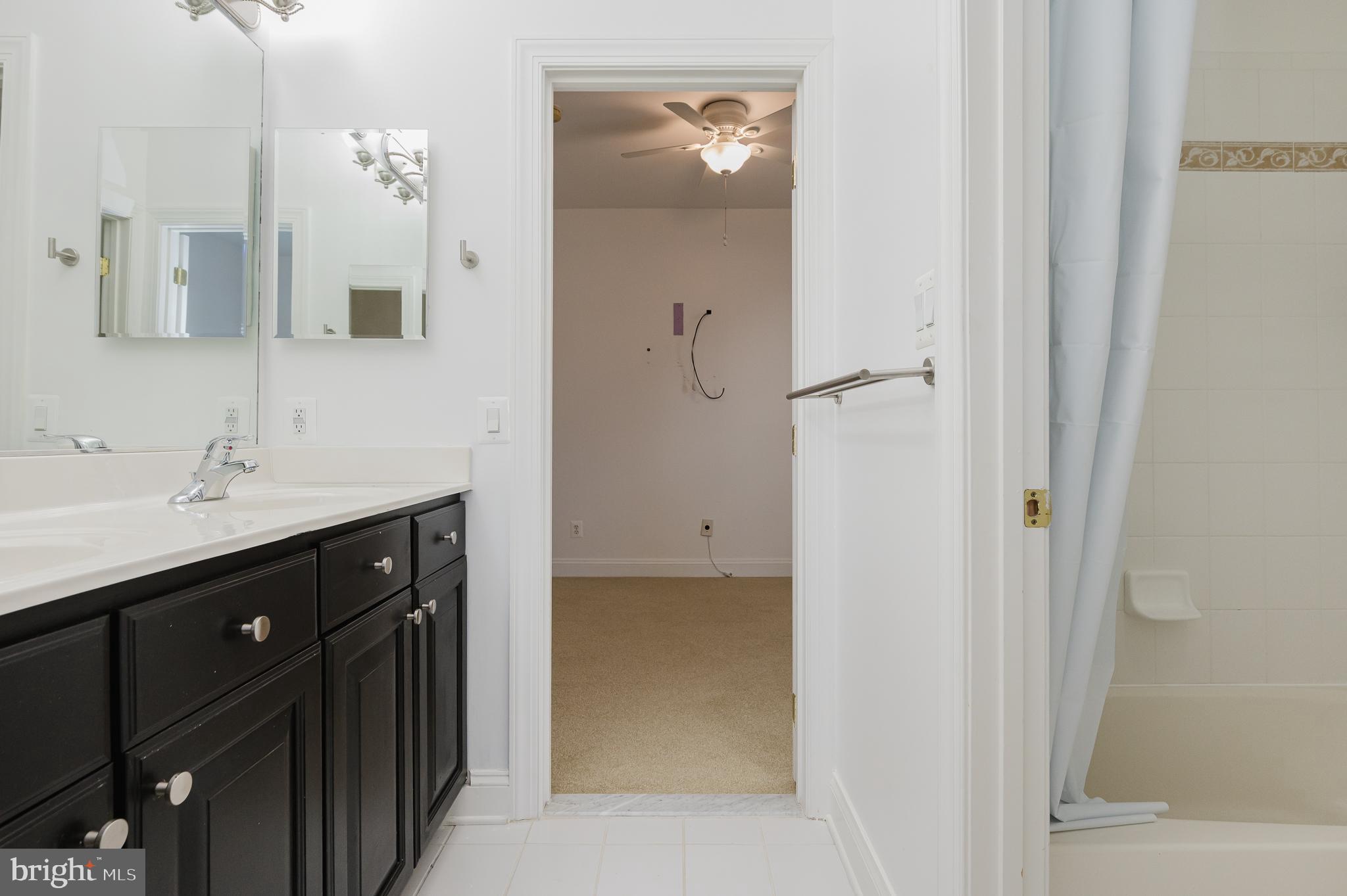 130 Fallston Meadow Court Fallston, MD 21047 - Photo 53 of 80 a bathroom with a double vanity sink shower and mirror
