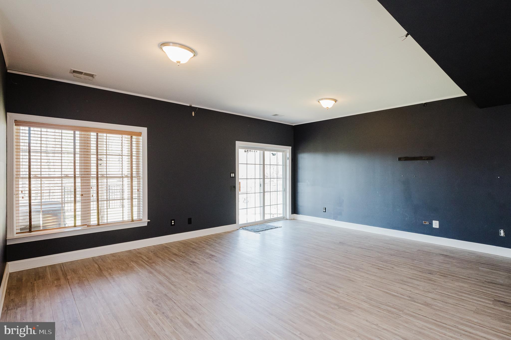 130 Fallston Meadow Court Fallston, MD 21047 - Photo 60 of 80 a view of an empty room with wooden floor and a window