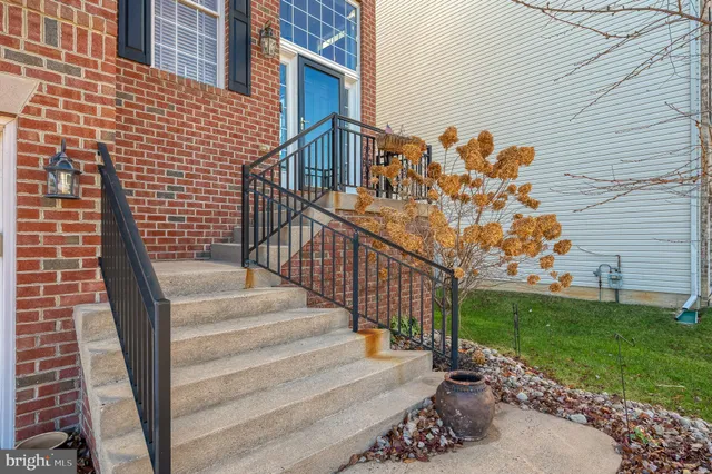 a view of a balcony with a floor to ceiling window and stairs