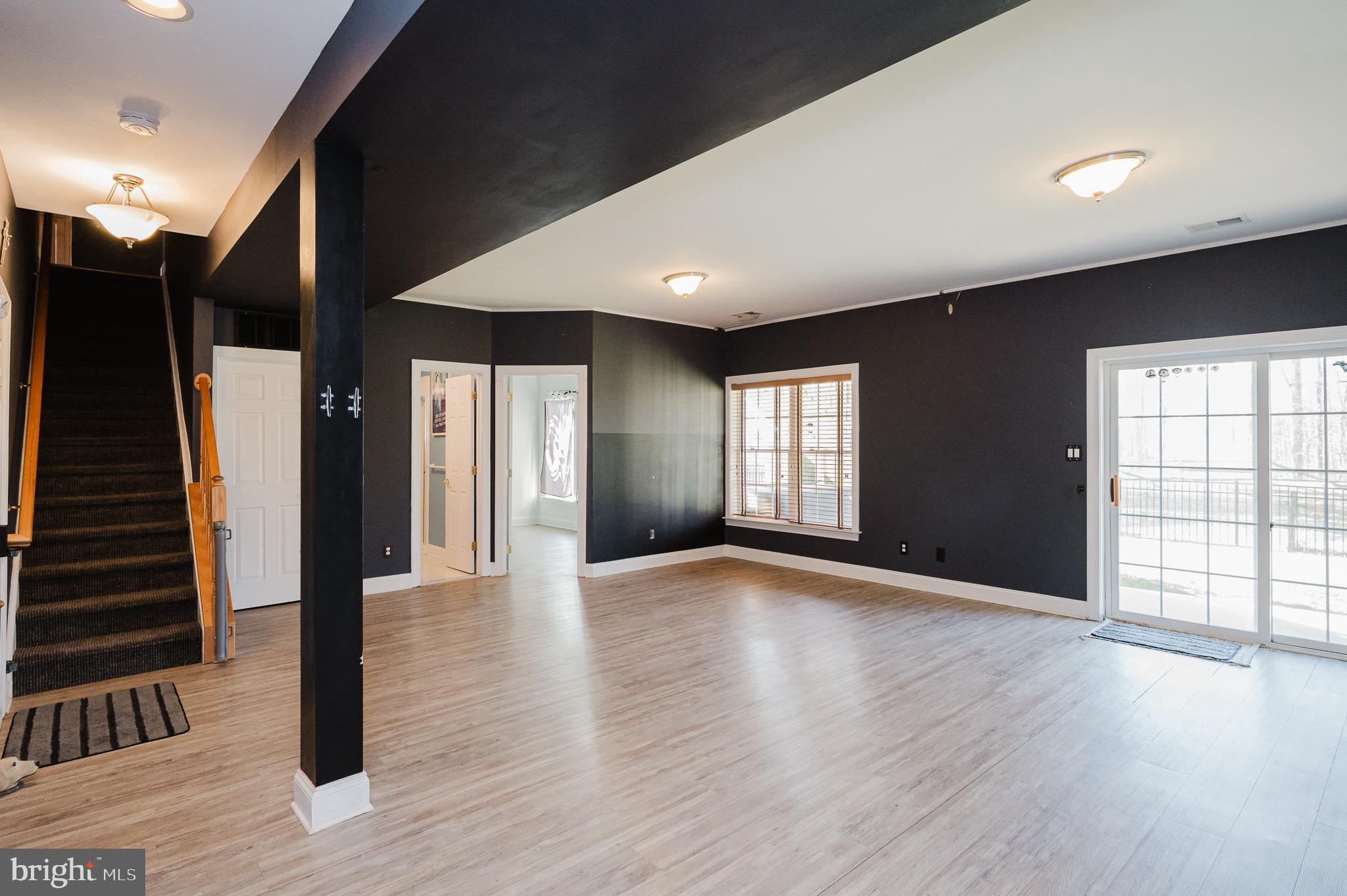 130 Fallston Meadow Court Fallston, MD 21047 - Photo 61 of 80 a view of an empty room with wooden floor and a window