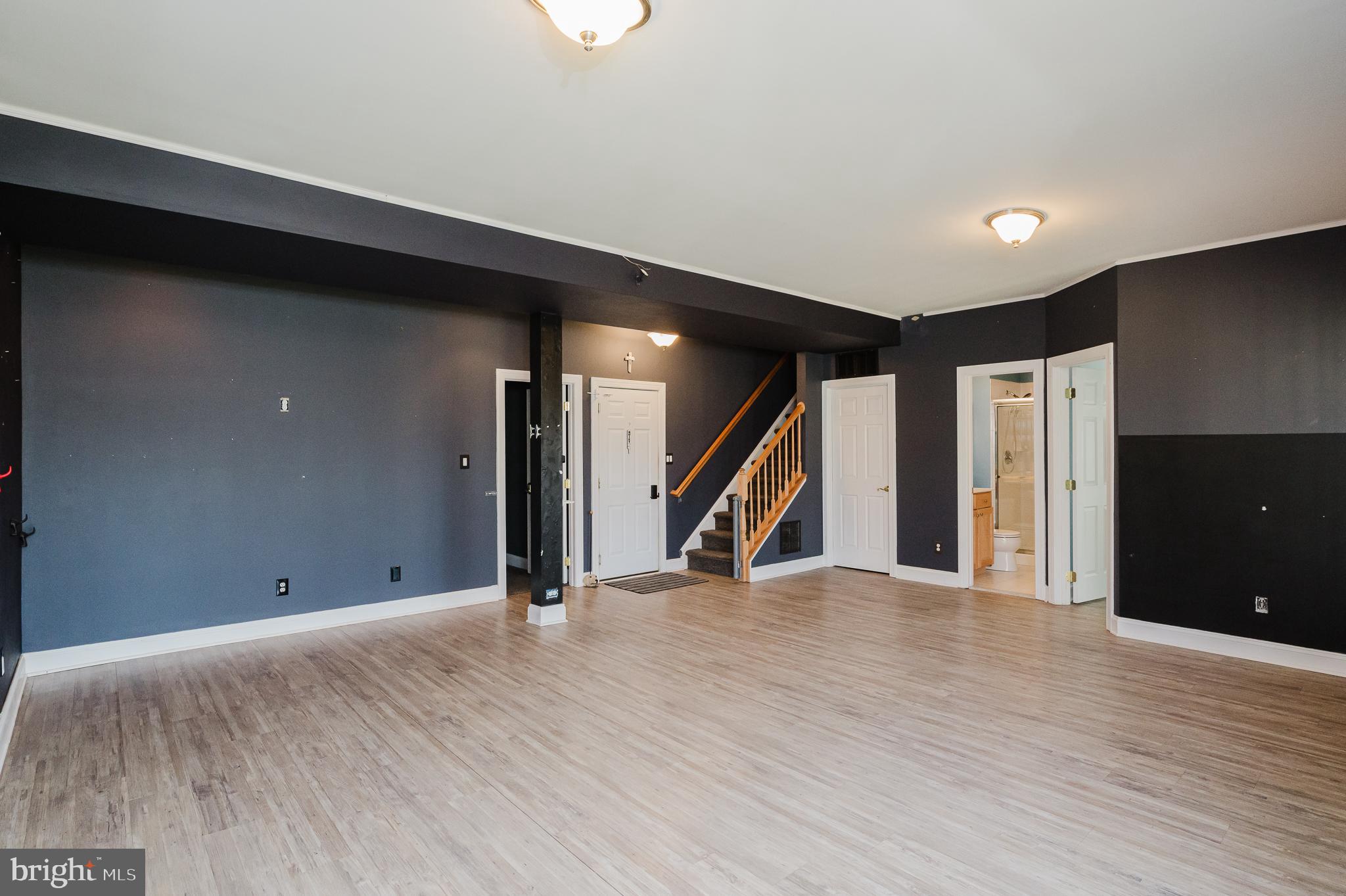 130 Fallston Meadow Court Fallston, MD 21047 - Photo 63 of 80 an empty room with wooden floor and stairs