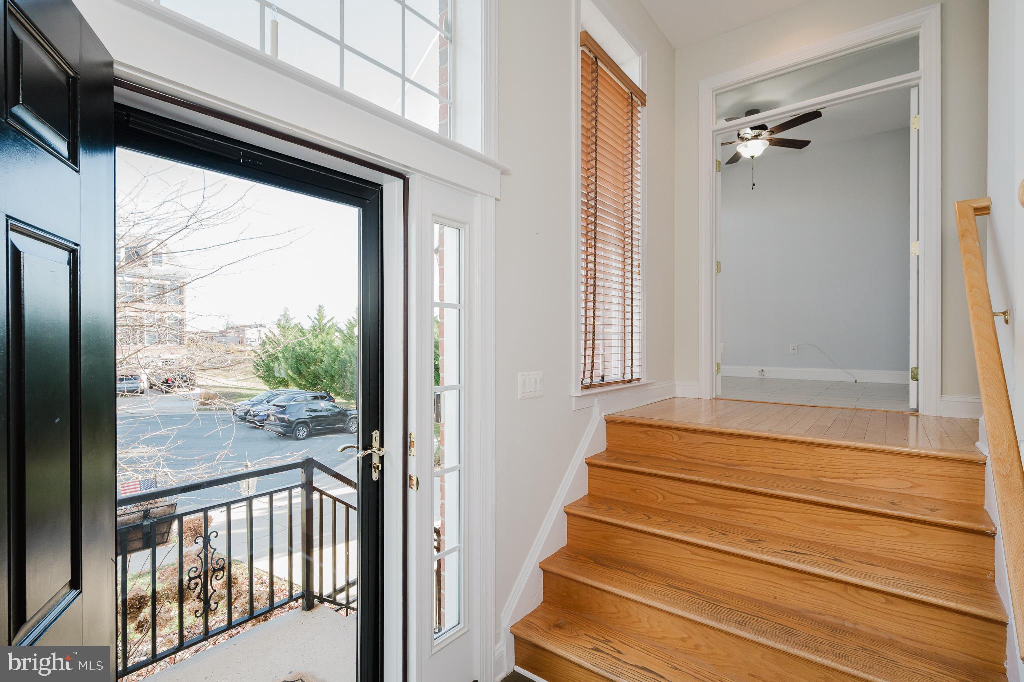 130 Fallston Meadow Court Fallston, MD 21047 - Photo 8 of 80 a view of a balcony with a floor to ceiling window and stairs