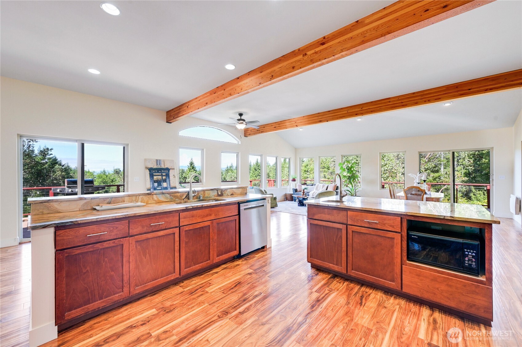 83 Octopus Court Quilcene, WA 98376 - Photo 15 of 40 a kitchen with stainless steel appliances granite countertop sink stove and wooden floor