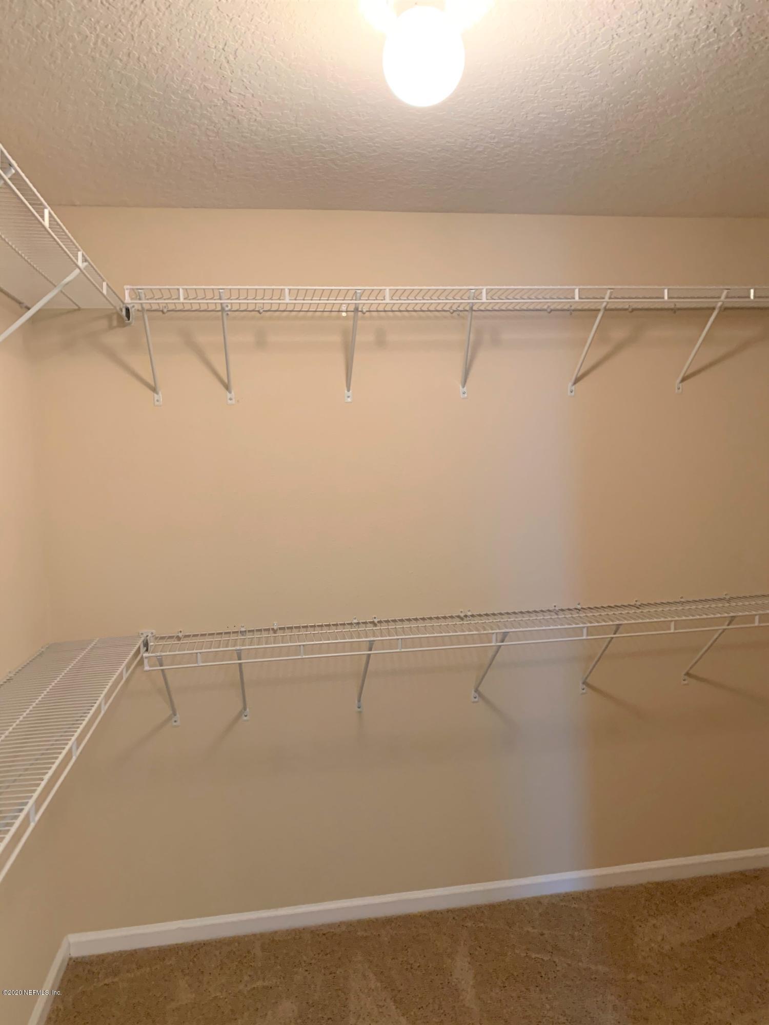 203 Providence Drive St. Augustine, FL 32092 - Photo 12 of 21 a view of a room with racks on the wall