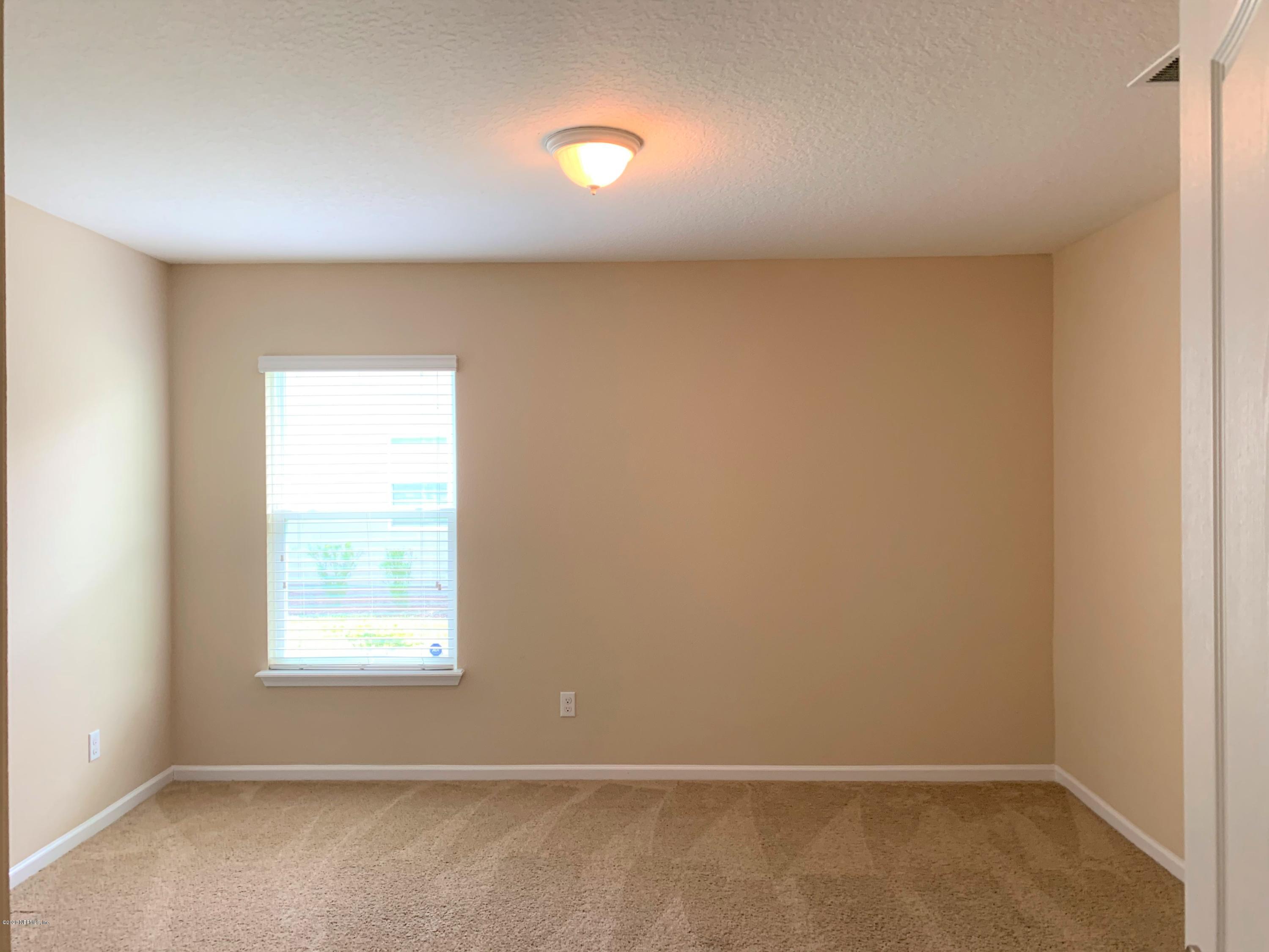 203 Providence Drive St. Augustine, FL 32092 - Photo 17 of 21 an empty room with a window