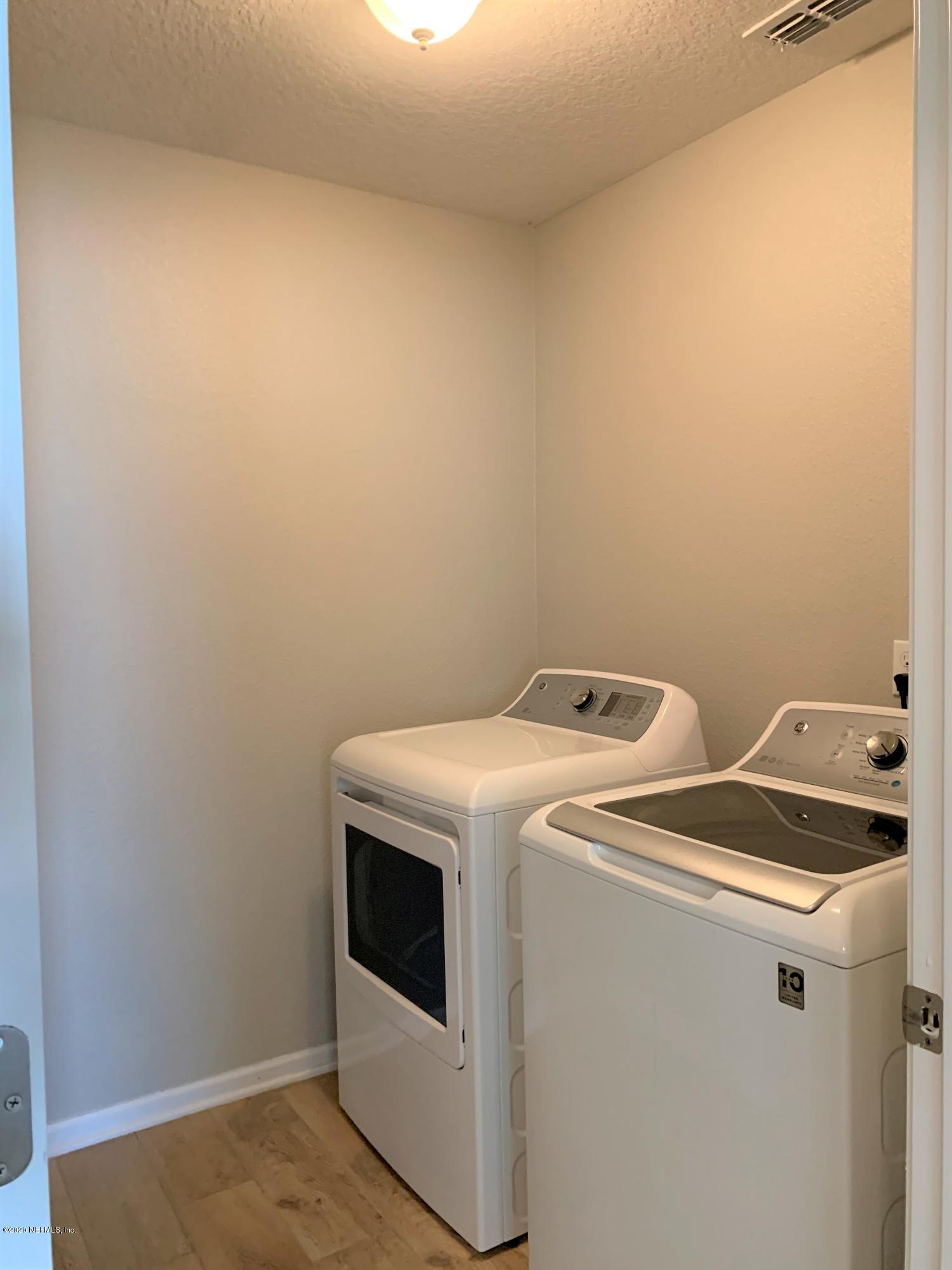 203 Providence Drive St. Augustine, FL 32092 - Photo 19 of 21 a utility room with dryer and washer