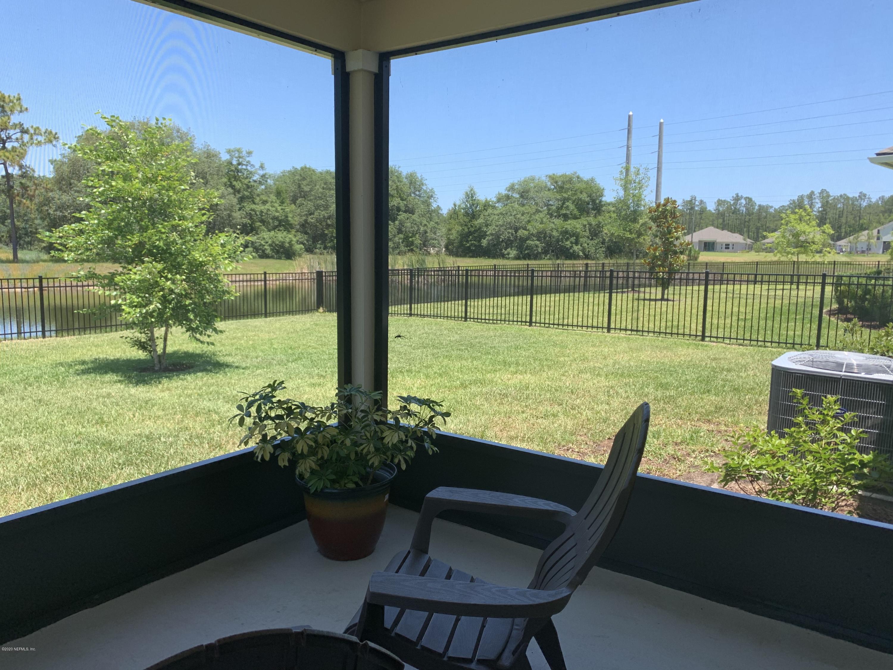 203 Providence Drive St. Augustine, FL 32092 - Photo 20 of 21 a view of a garden with an outdoor space