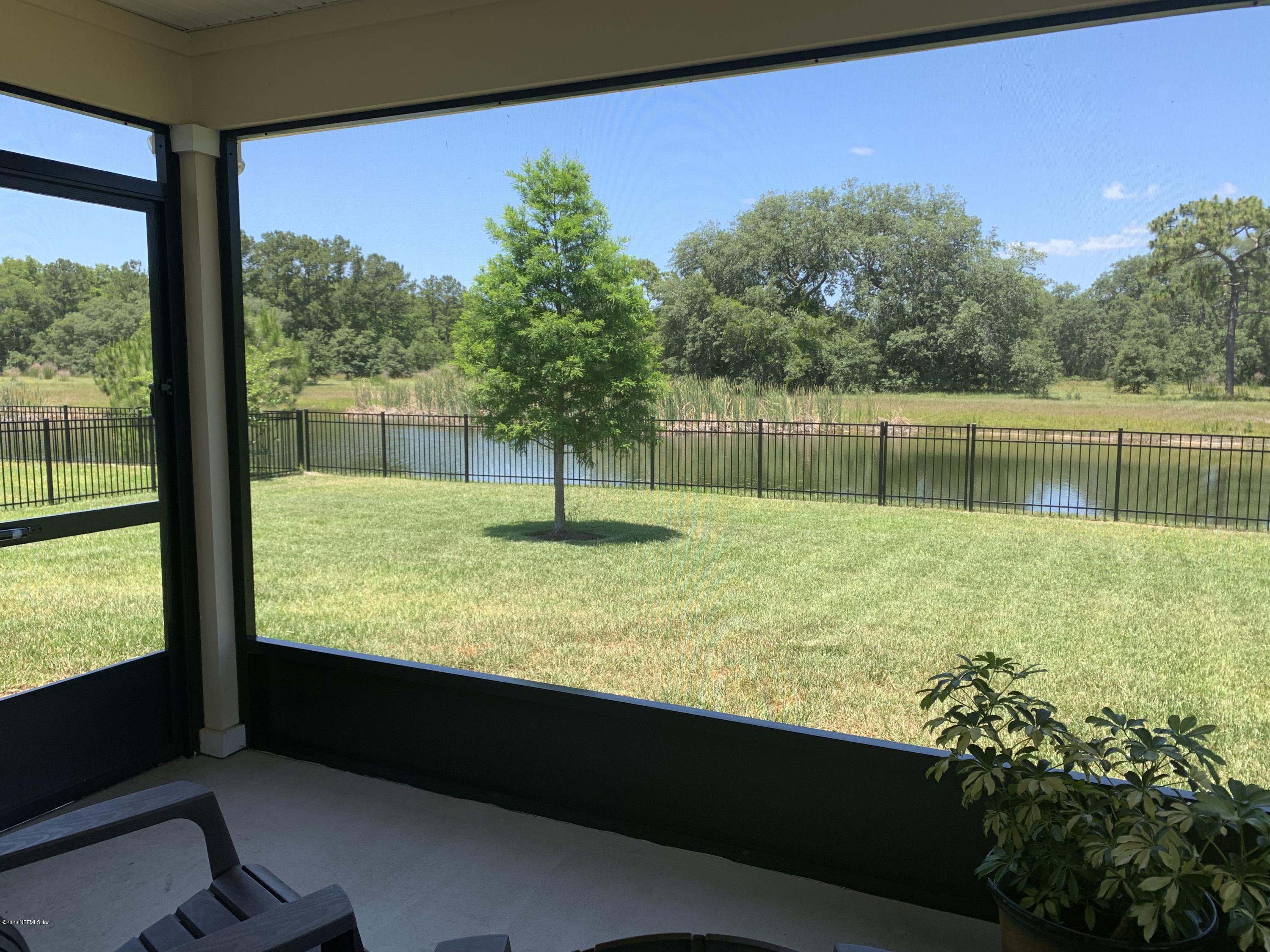 203 Providence Drive St. Augustine, FL 32092 - Photo 21 of 21 a swimming pool with lawn chairs