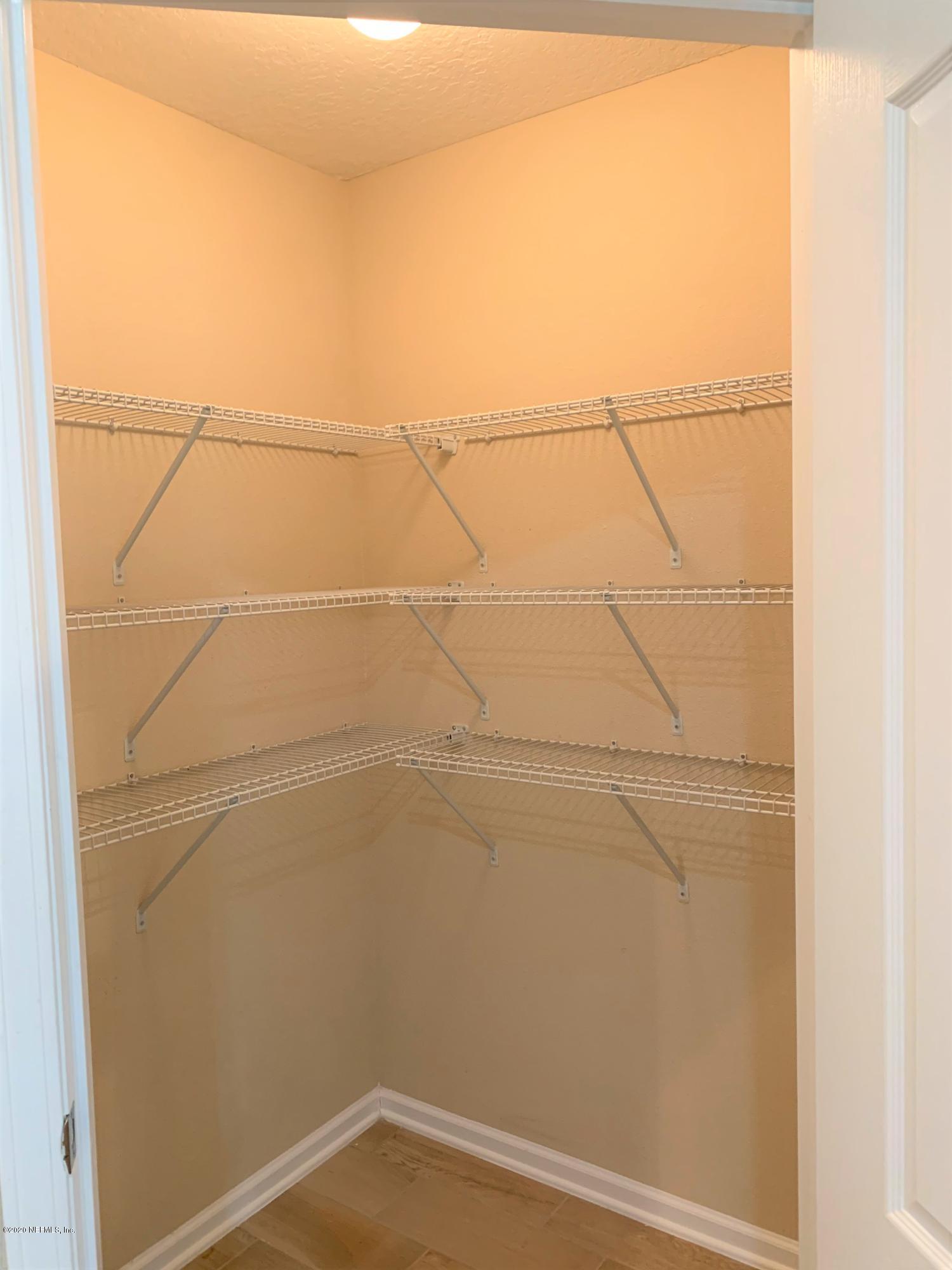 203 Providence Drive St. Augustine, FL 32092 - Photo 8 of 21 a view of a room with racks on the wall