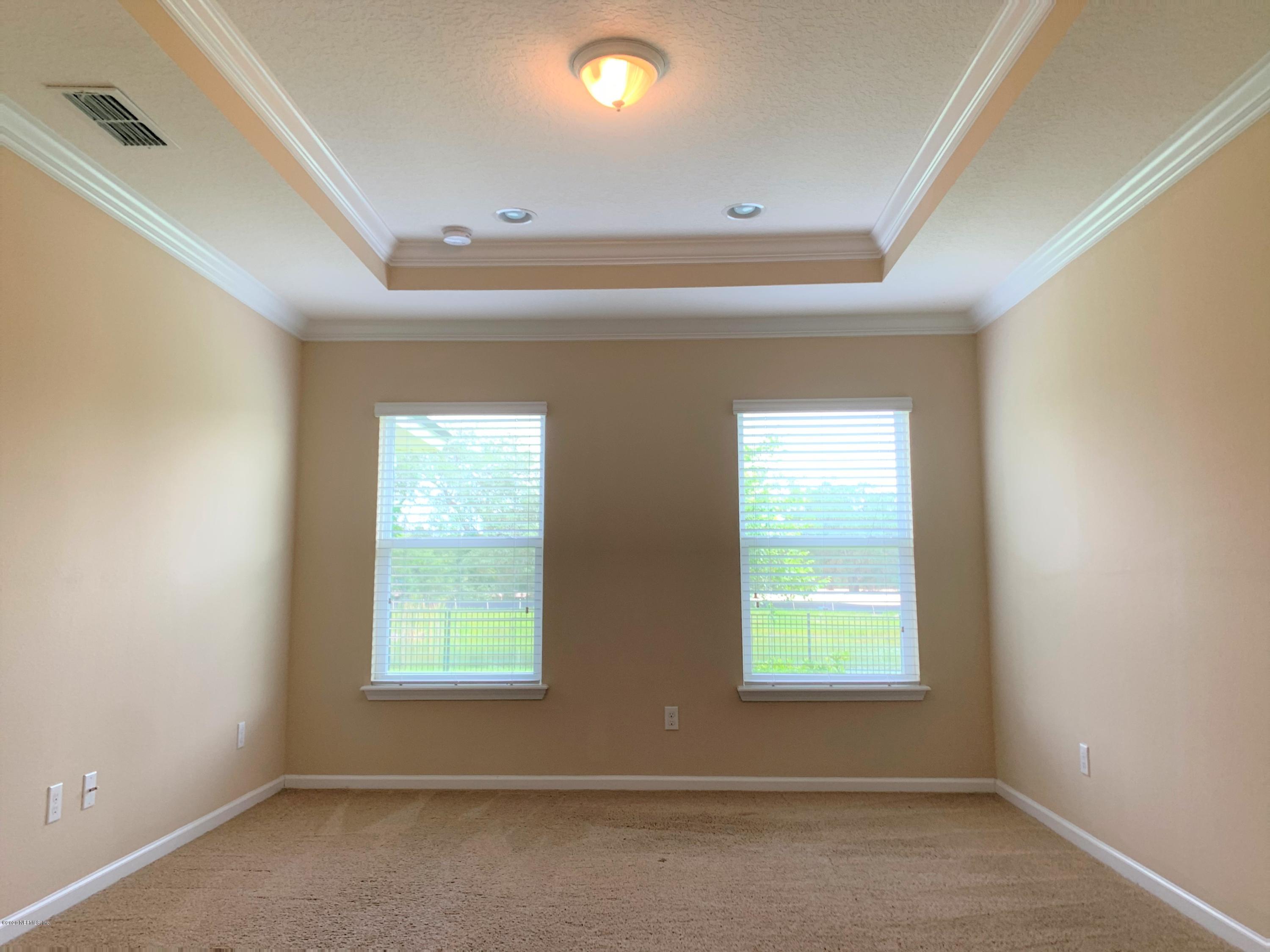 203 Providence Drive St. Augustine, FL 32092 - Photo 9 of 21 an empty room with windows