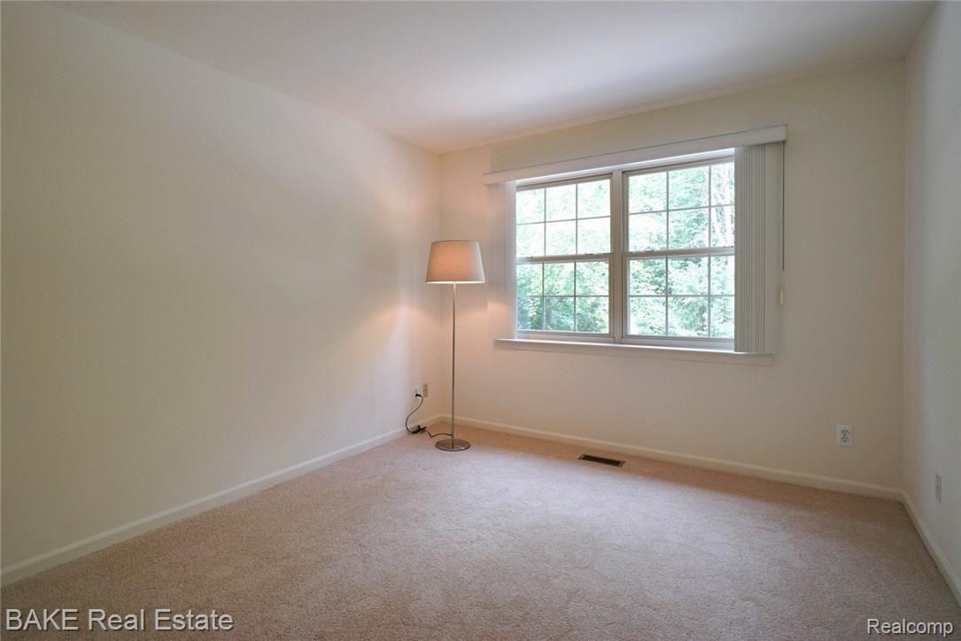 16954 Farmington Road, Unit 25 Livonia, MI 48154 - Photo 15 of 20 2nd Bedroom with wooded views