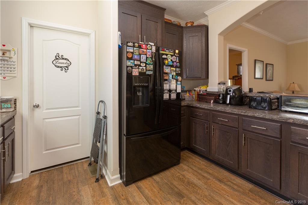 951 Stroupe Road Lancaster, SC 29720 - Photo 14 of 41 a kitchen with stainless steel appliances a refrigerator and a wooden floor