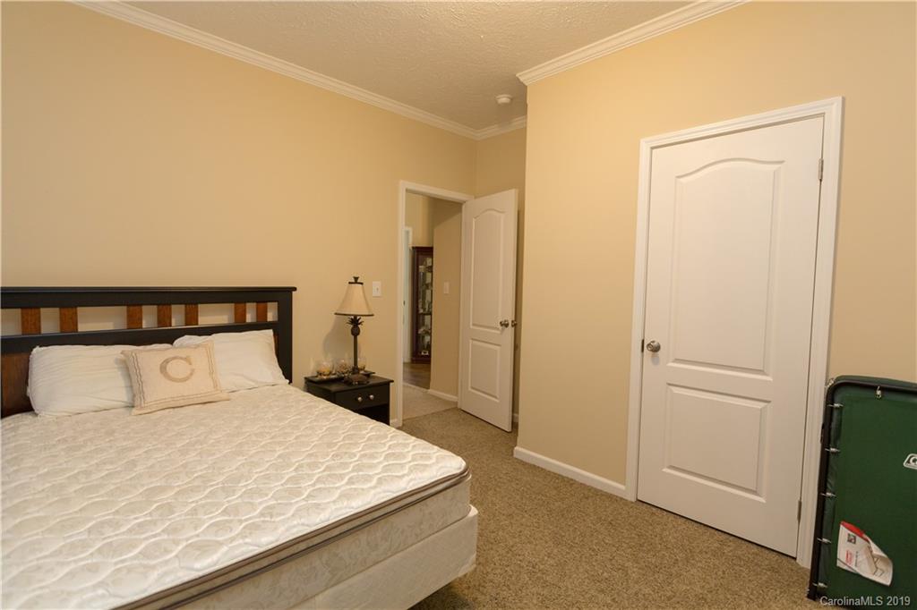 951 Stroupe Road Lancaster, SC 29720 - Photo 23 of 41 a bedroom with a bed and a refrigerator
