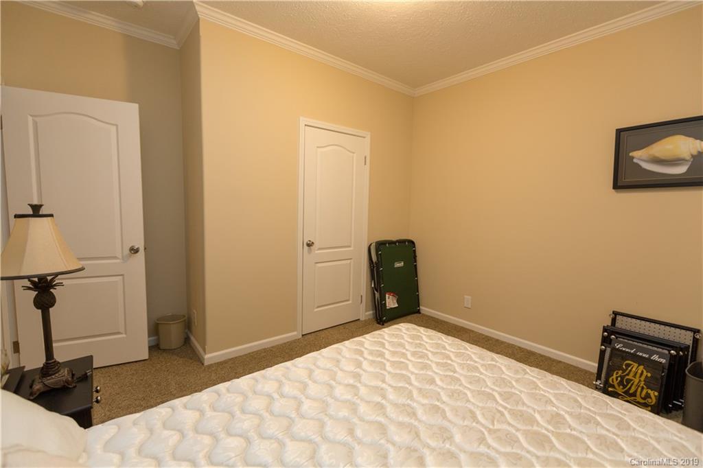 951 Stroupe Road Lancaster, SC 29720 - Photo 24 of 41 a bedroom with a bed and a table