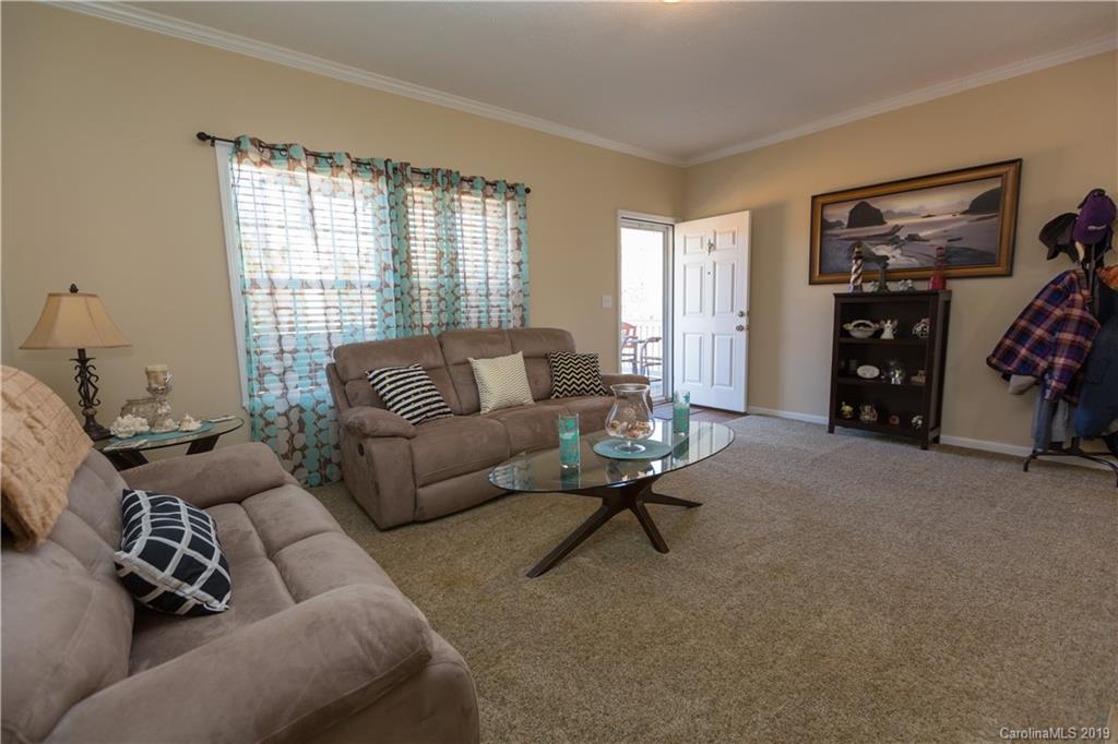 951 Stroupe Road Lancaster, SC 29720 - Photo 4 of 41 a living room with furniture and a flat screen tv