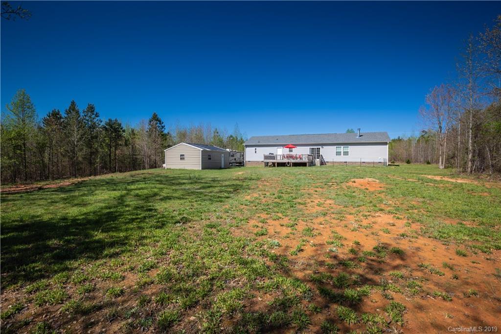 951 Stroupe Road Lancaster, SC 29720 - Photo 33 of 41 a view of a field with an trees