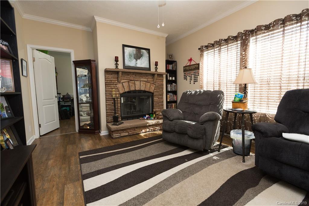 951 Stroupe Road Lancaster, SC 29720 - Photo 7 of 41 a living room with furniture and a fireplace