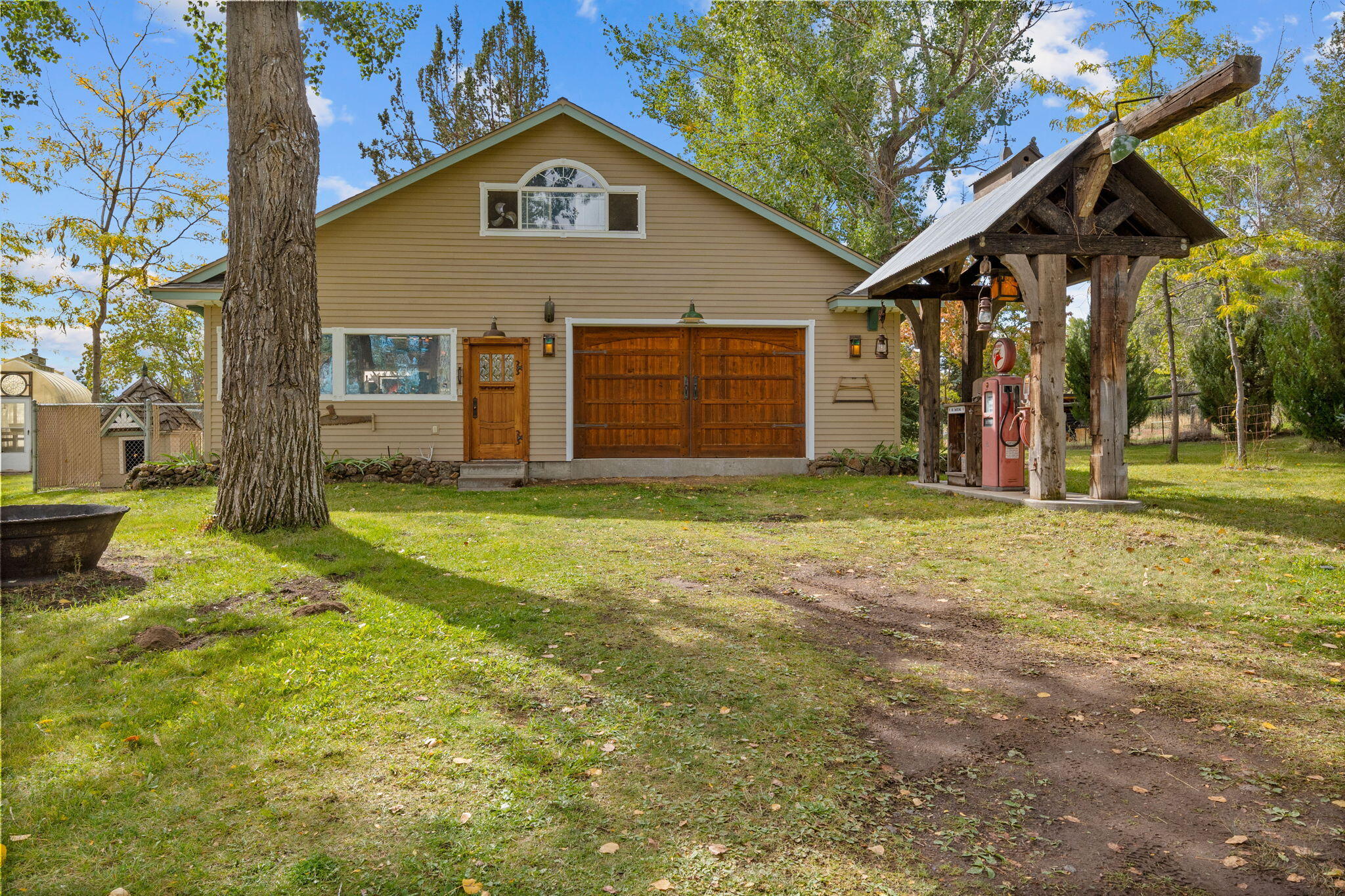 21925 Bear Creek Road Bend, OR 97702 - Photo 70 of 104 a view of a house with a yard and tree s