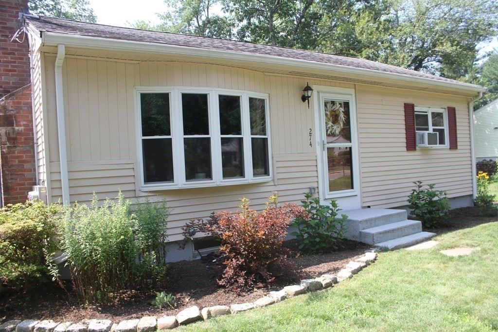 274 Cordaville Road Ashland, MA 01721 - Photo 41 of 42 a front view of a house with garden