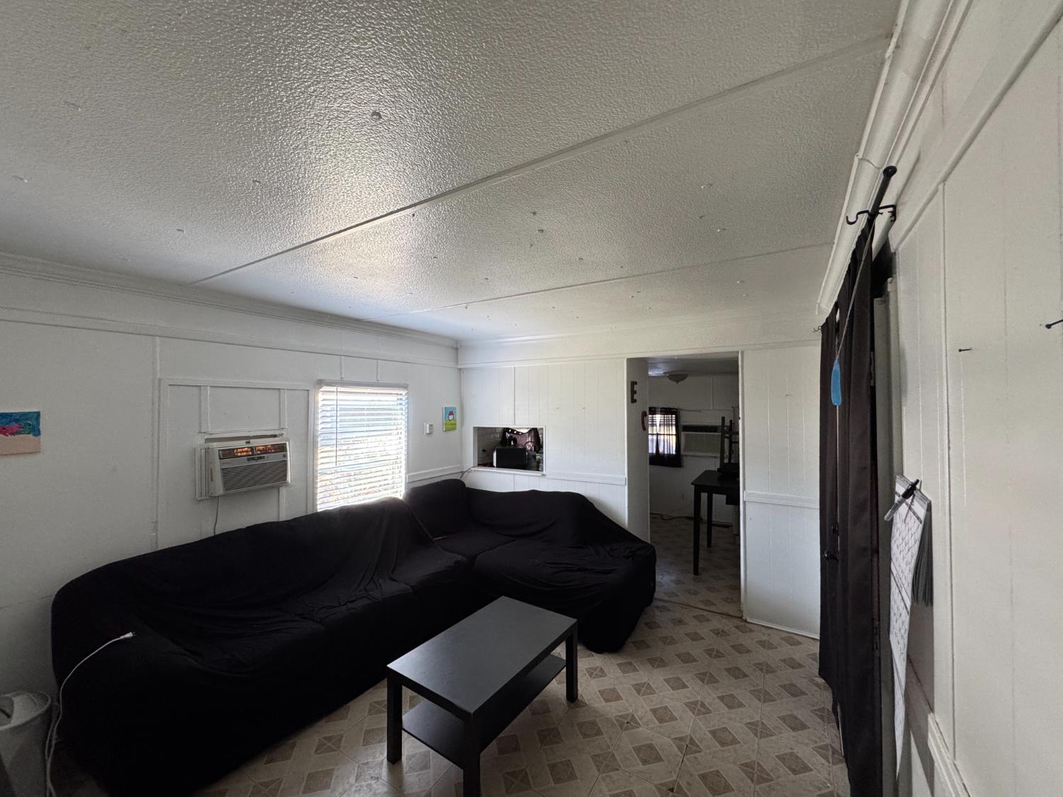 1781 Franklin Road, Unit 36 Yuba City, CA 95993 - Photo 3 of 12 a living room with furniture and a dresser
