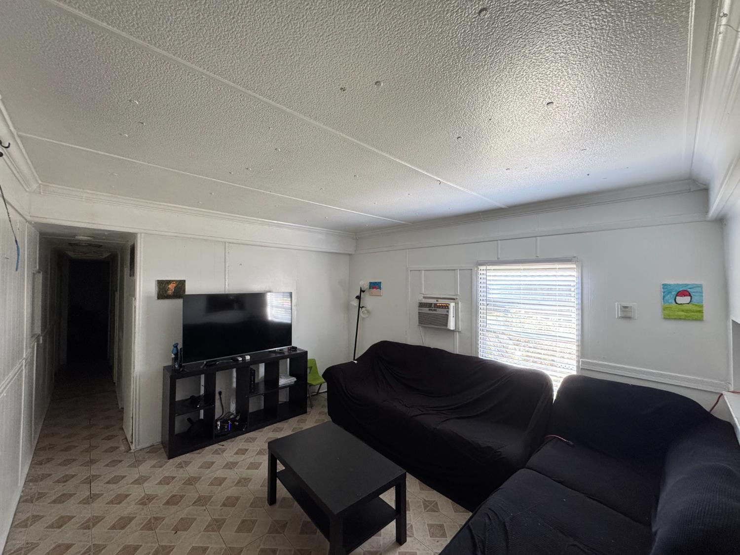 1781 Franklin Road, Unit 36 Yuba City, CA 95993 - Photo 4 of 12 a living room with furniture and a flat screen tv