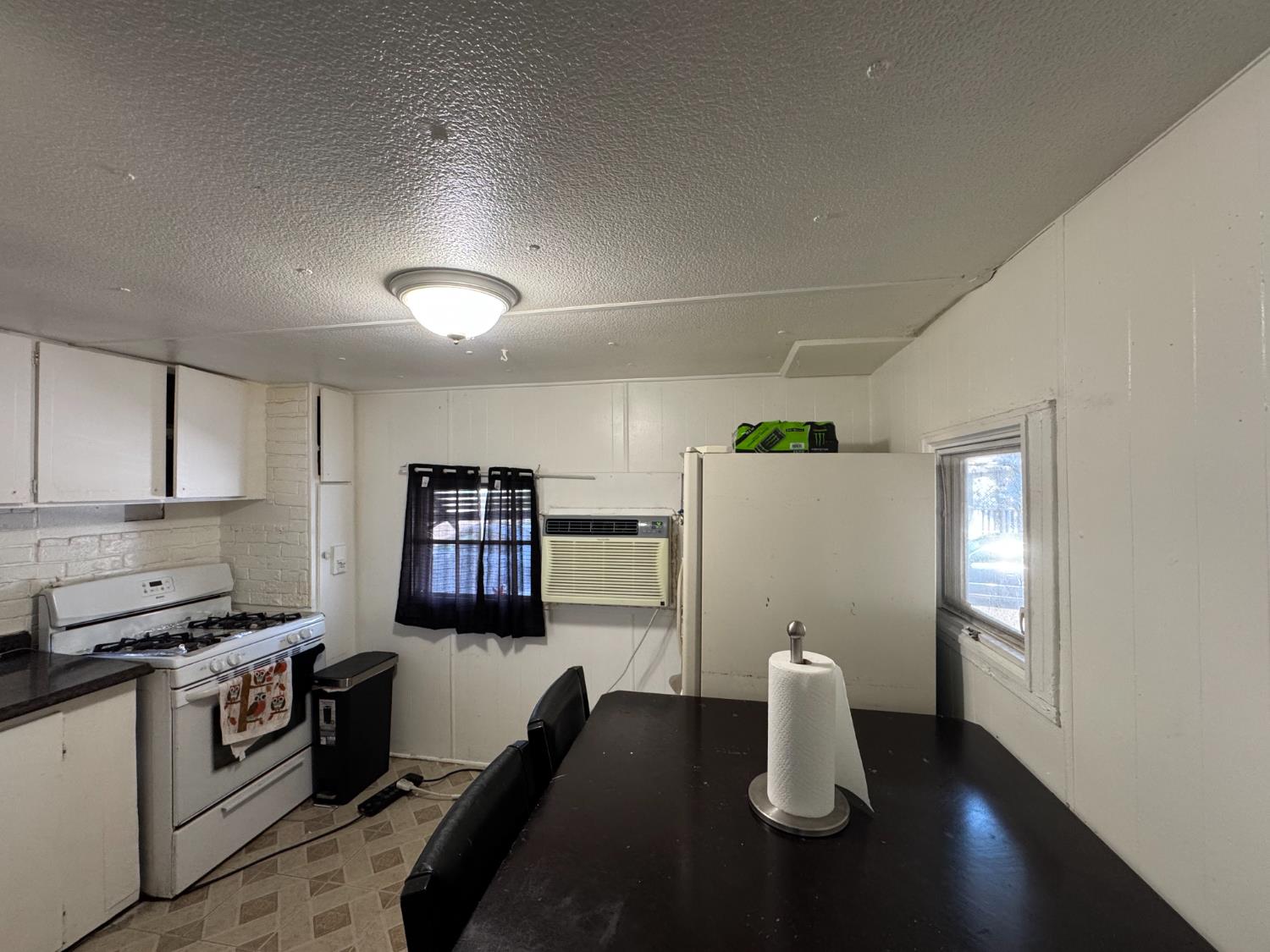 1781 Franklin Road, Unit 36 Yuba City, CA 95993 - Photo 5 of 12 a kitchen with refrigerator and stove
