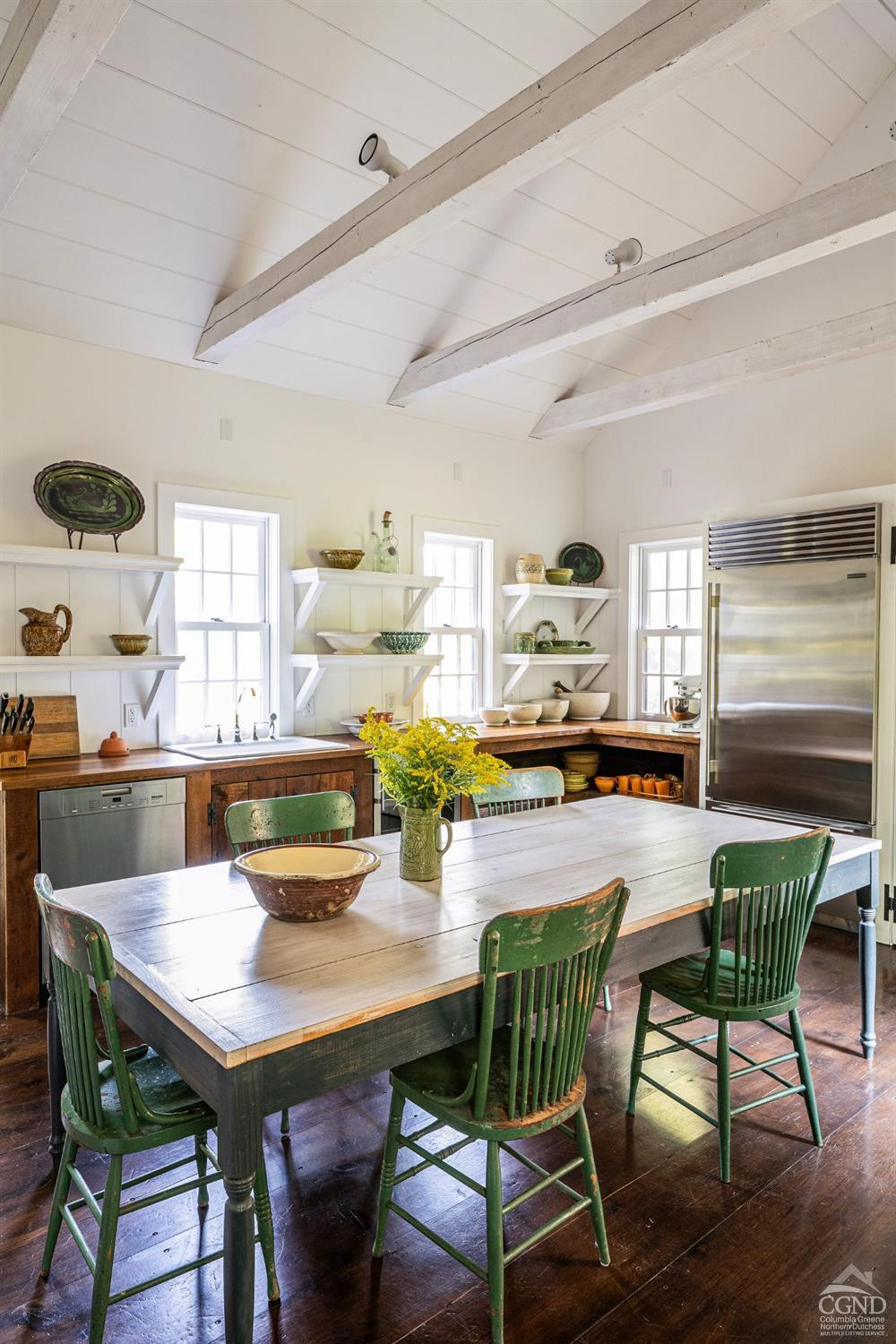 1039 County Route 13 Chatham, NY 12136 - Photo 21 of 48 a view of a dining room with furniture and wooden floor