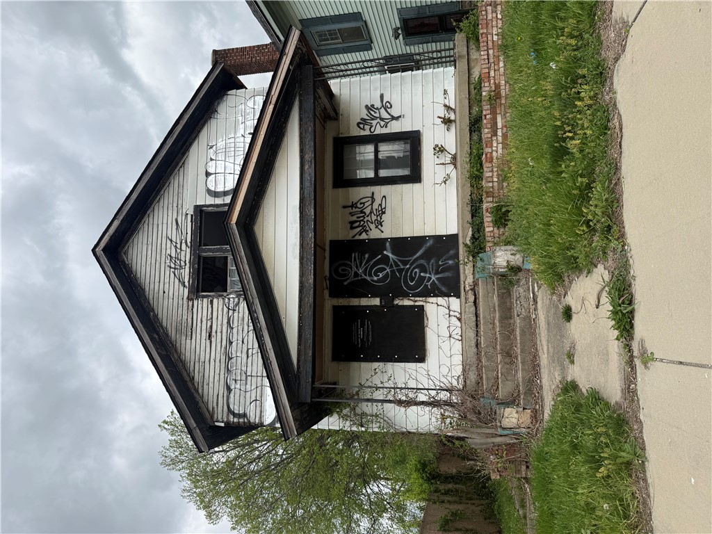 937 Springfield Street Dayton, OH 45403 - Photo 1 of 1 This property features wood siding, offering a classic aesthetic.