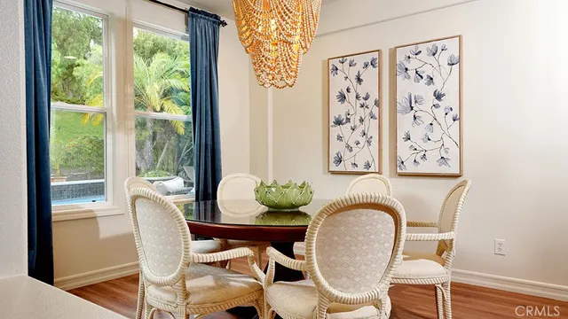 a kitchen with a table and chairs in it