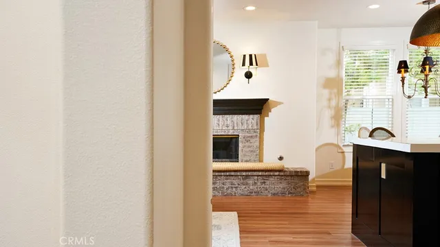 a view of a living room with furniture and a fireplace
