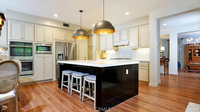 a living room with furniture large window and fireplace