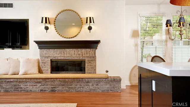 a bathroom with a granite countertop toilet sink and mirror