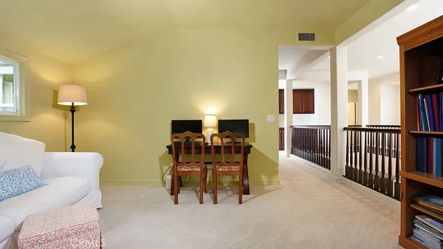 a view of swimming pool with lounge chair and trees