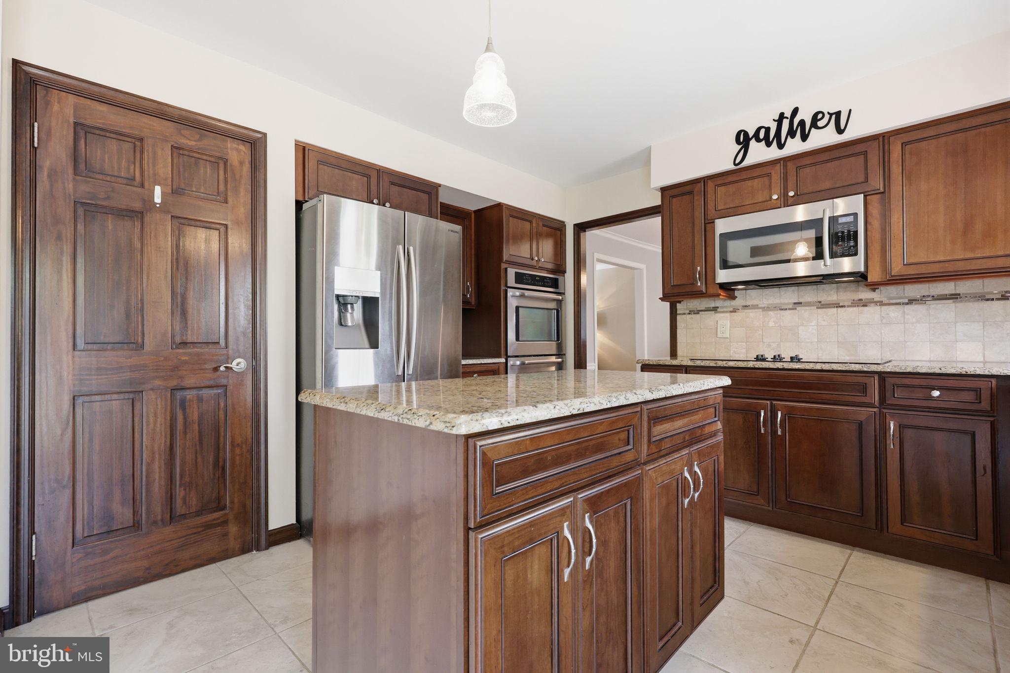 1140 Charter Road Warminster, PA 18974 - Photo 10 of 37 Modern kitchen with rich wood accents.