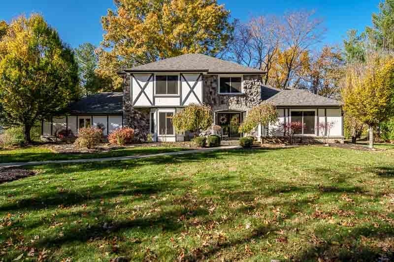 11948 Southgate Road Roscoe, IL 61073 - Photo 1 of 73 a front view of a house with a yard table and chairs