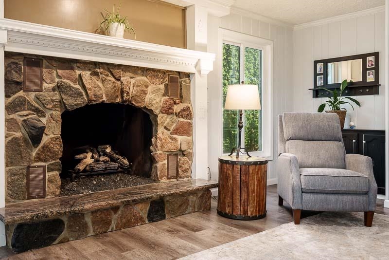 11948 Southgate Road Roscoe, IL 61073 - Photo 15 of 73 a living room with furniture and a fireplace